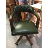 A Green leather captains chair