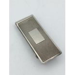 A silver money clip, hallmarked London 1989, makers mark DB