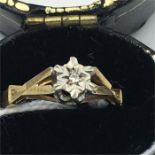 A 9ct gold and diamond ring