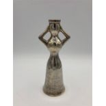 A silver candlestick in the shape of a woman, marked 925 by Greek silversmith Ilias Lalaounis.