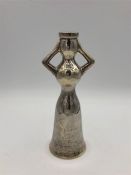 A silver candlestick in the shape of a woman, marked 925 by Greek silversmith Ilias Lalaounis.