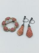 A coral earring set with brooch