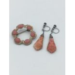 A coral earring set with brooch