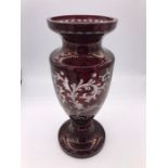 A 10th Century ruby Bohemian overlay glass trophy shaped vase