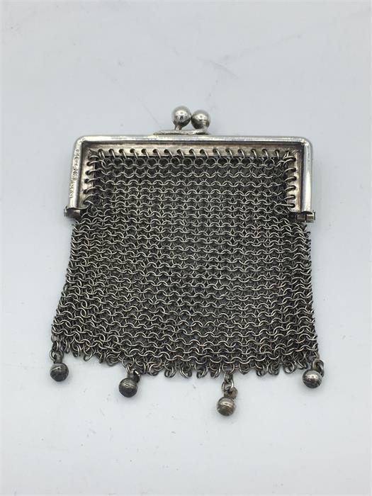 A silver Ladies coin purse, in a mesh style.