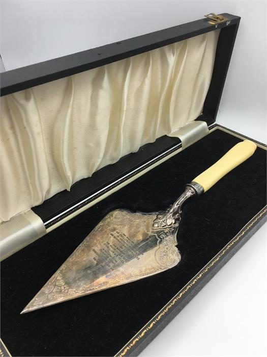 A ceremonial trowel in boxed case bearing the inscription: 'This trowel was used by his excellency