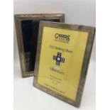 Two hallmarked silver picture frames 19cm x 24cm and 23cm x 18cm