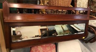 A Mahogany hall mirror with shelf