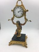 EARLY 20TH CENTURY FRENCH GILT BRONZE EMPIRE STYLE TRIBESWOMAN FIGURAL DESK CLOCK Supporting drum