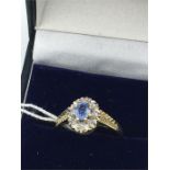 A 9ct gold Aquamarine and Diamond ring