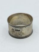 A silver napkin ring hallmarked Sheffield 1912 by JD & S