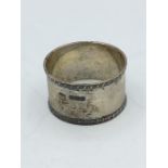 A silver napkin ring hallmarked Sheffield 1912 by JD & S