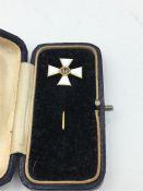 A Russian Order of St George lapel pin in gold and enamel
