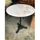 A marble top cast iron bistro table