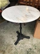 A marble top cast iron bistro table