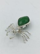 A silver and jade spider brooch