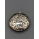 A silver locket, hallmarked Birmingham 1918