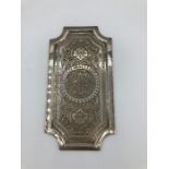 A Persian silver plate and small tray