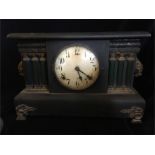 A wooden American mantle clock.