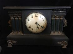 A wooden American mantle clock.