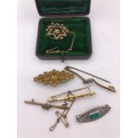 A selection of brooches and costume jewellry