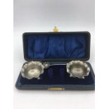 A cased pair of salts by William Aitken, hallmarked Birmingham 1904.