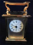 A Carriage Clock in brass with a hallmarked silver face. Rency Anglaise by Taylor Bligh No 10 of a