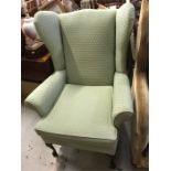 A wing back chair