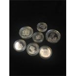 Seven silver proof coins in plastic cases, 2006 Gibraltar 5 pound crown, 1994 Jamaica 25 dollars,