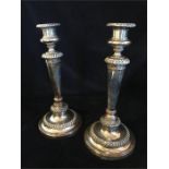 A pair of silver plated candlesticks