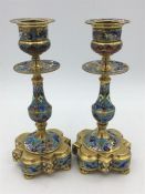 LATE 19TH CENTURY FRENCH BRONZE CHAMPLEVE ENAMEL A PAIR CANDLESTICKs. 16cm high