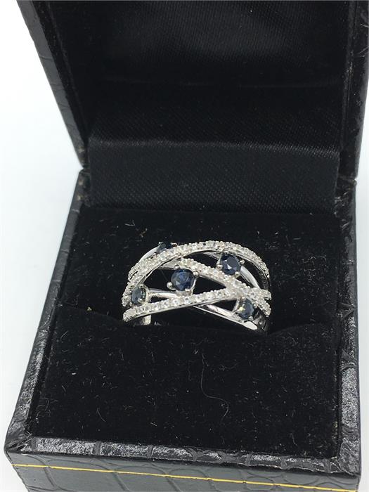 A 14ct White Gold blue and white sapphire ring