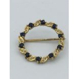A 9ct gold sapphire and diamond brooch