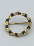 A 9ct gold sapphire and diamond brooch