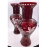 A pair of mid 19th Century Bohemian ruby glas vases engraved with vine and grapes.