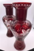 A pair of mid 19th Century Bohemian ruby glas vases engraved with vine and grapes.