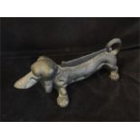 A cast iron Dachshund boot scraper