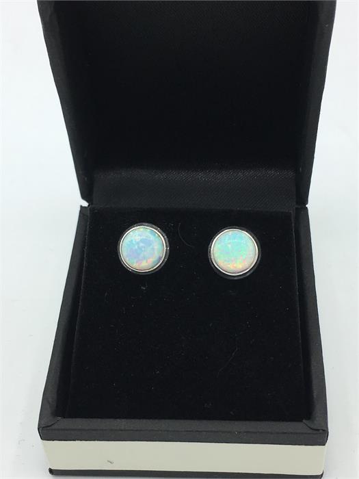 A pair of silver and opal stud earrings