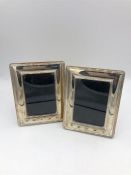 A pair of rectangular hallmarked silver photo frames 13cm x 10 cm