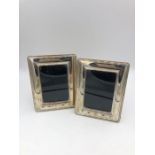 A pair of rectangular hallmarked silver photo frames 13cm x 10 cm