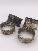 Two pairs of hallmarked silver napkin rings (45g)