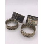 Two pairs of hallmarked silver napkin rings (45g)