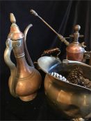 A collection of copper and brass items to include a coal scuttle, kettle etc.
