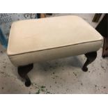 A cream foot stool