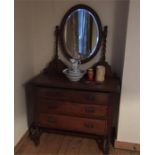 A mahogany dressing table with mirror