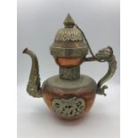 An Oriental copper tea pot