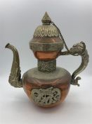 An Oriental copper tea pot