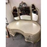 A white dressing table and side tables
