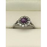 A Diamond and Amethyst ring set in a platinum setting.