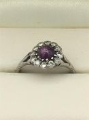 A Diamond and Amethyst ring set in a platinum setting.